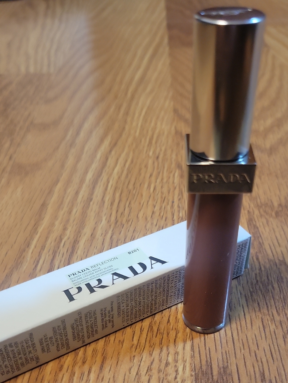 Prada Liquid Lip Color in Metallic Gold-Capped Brown